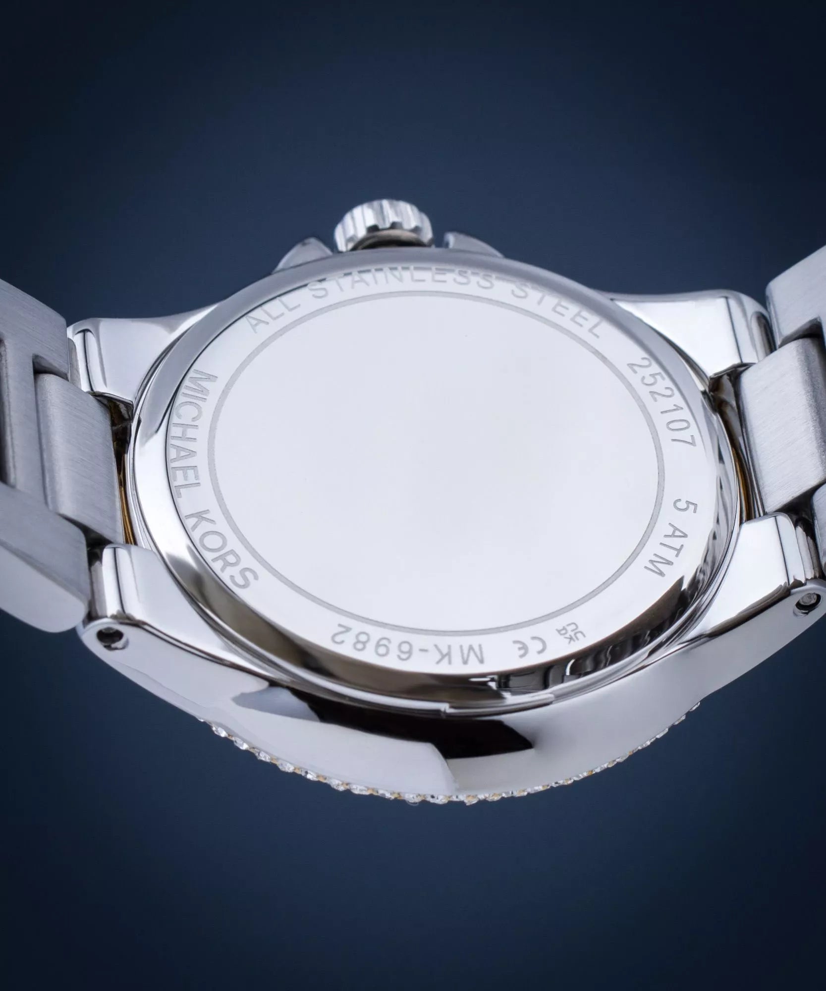 Mich@el Kors
Petite montre Camille bicolore avec pierres pavées