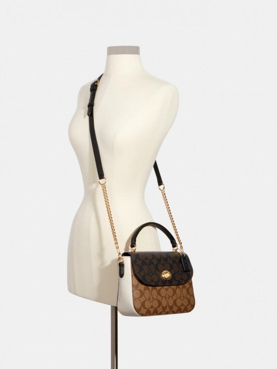 Sac à main Co@ch Marlie à poignée supérieure en toile à motif signature.