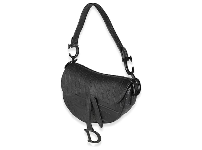 Christian Di*r Sac à dos moyen de veau noir oblique embossé