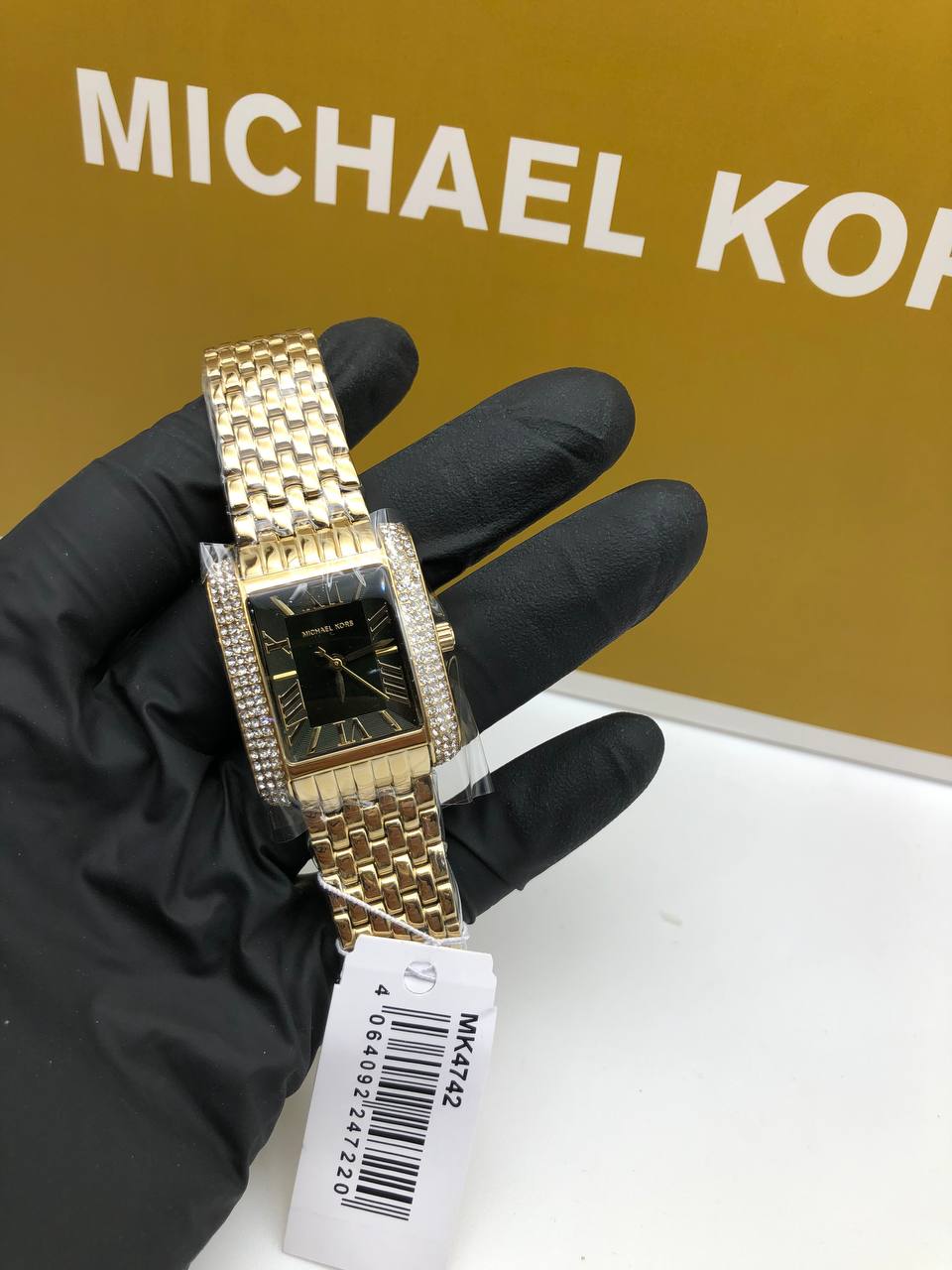Montre Mich@el Kors Emery à trois aiguilles en acier inoxydable doré