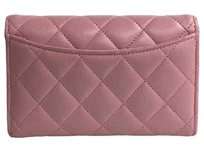 Portefeuille bi-fold d'agneau matelassé Chanel Rose