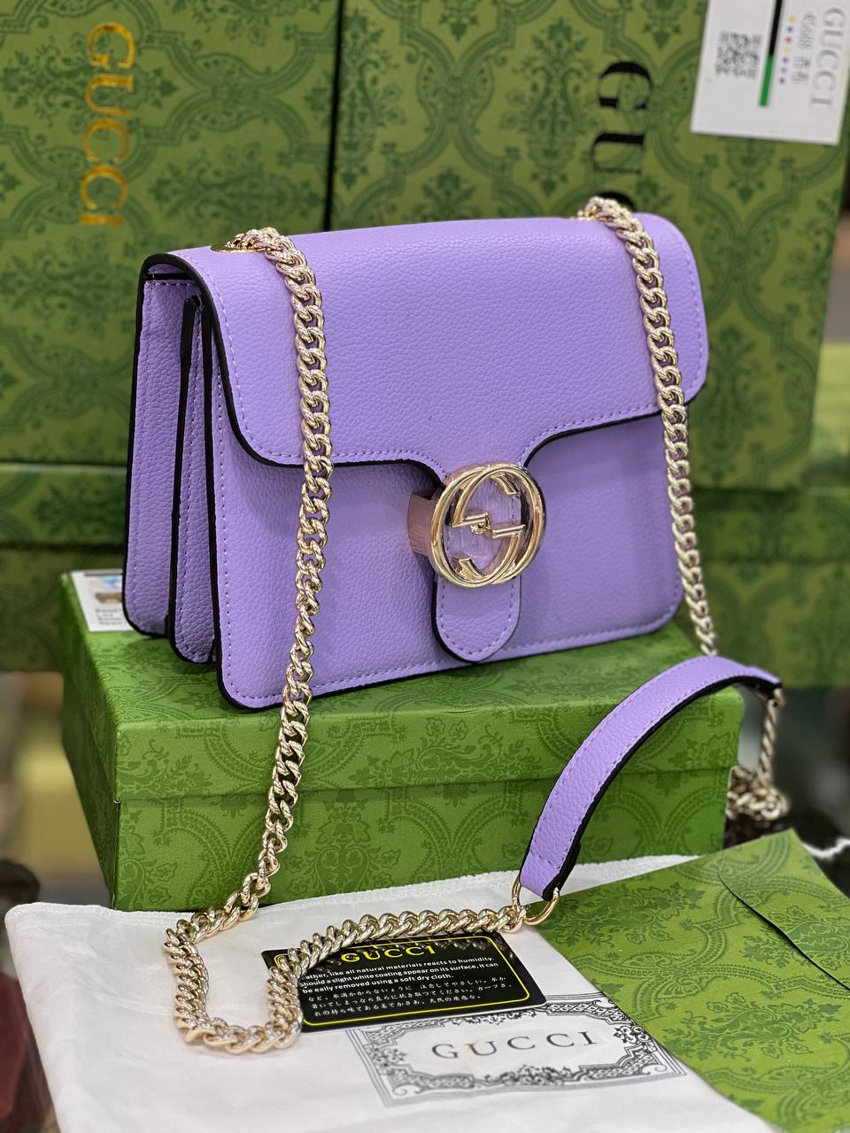 GG dollar veau bleu chaîne verrouillable sac à main