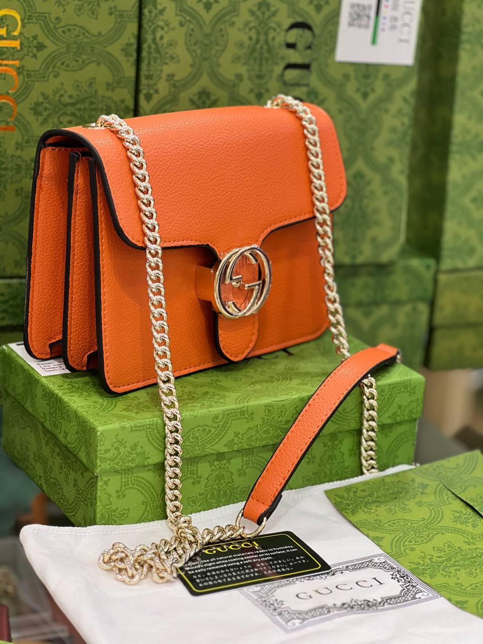GG Sac à bandoulière orange à petit dollar entrelacé