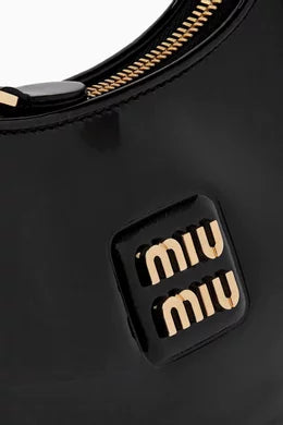 MIÜ MIÛ Petit sac hobo verni