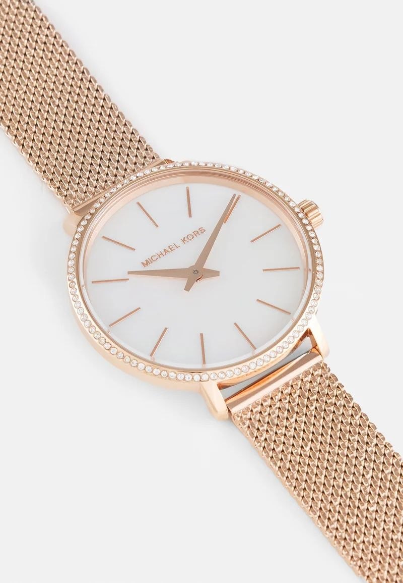 Michael Kors
Mini montre Pyper ton or rose avec pierres pavées