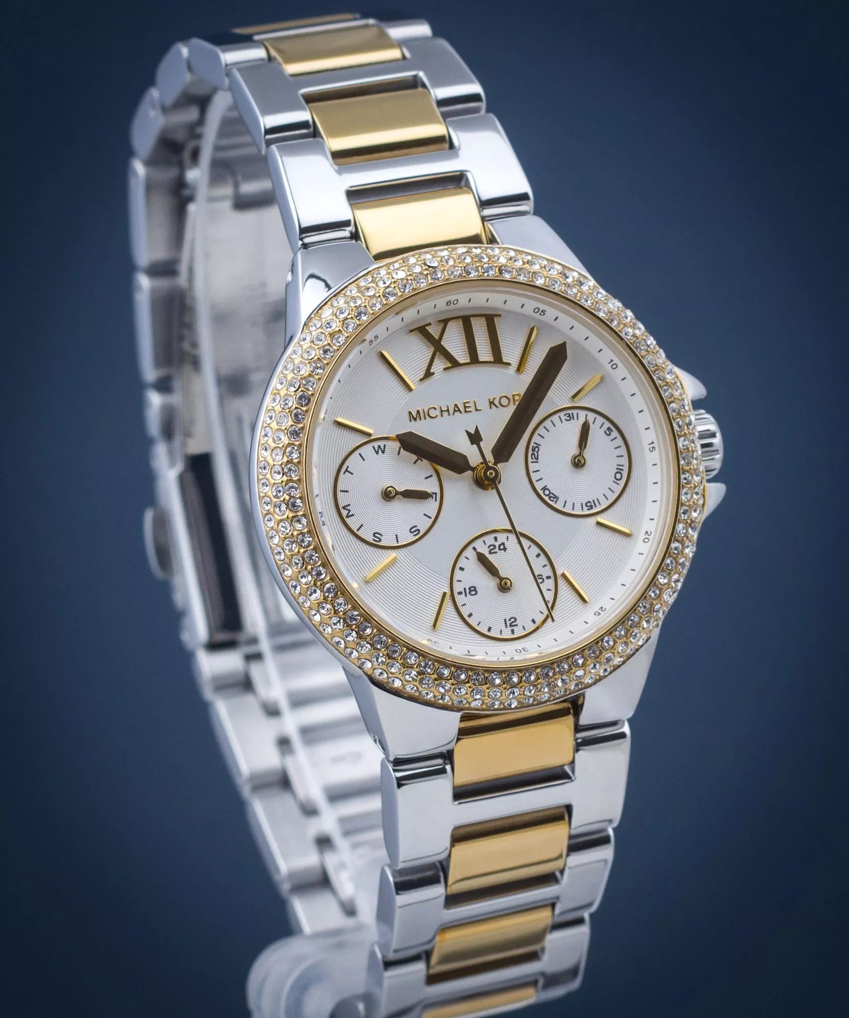 Mich@el Kors
Petite montre Camille bicolore avec pierres pavées