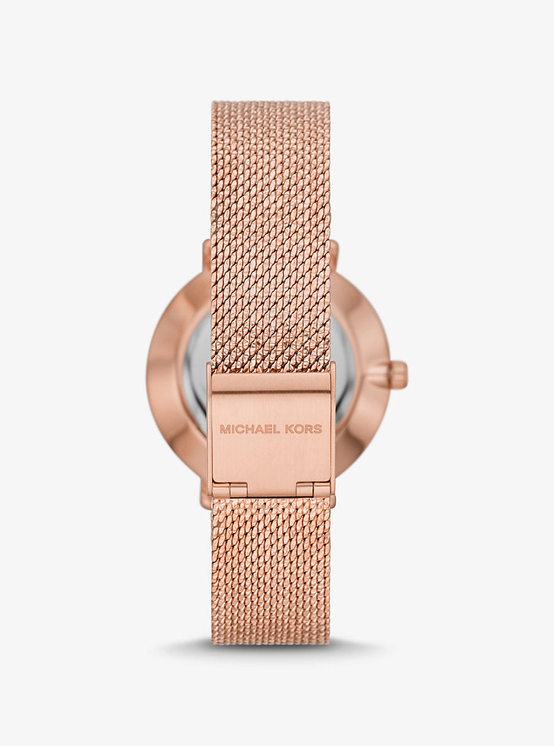Michael Kors
Mini montre Pyper ton or rose avec pierres pavées