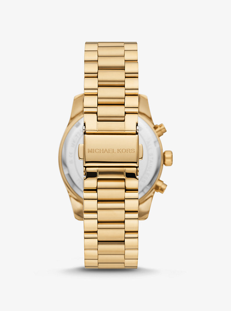 MK Montre Lexington dorée avec pierres pavées