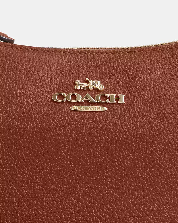 Co@ch Sac bandoulière Teri avec rivets