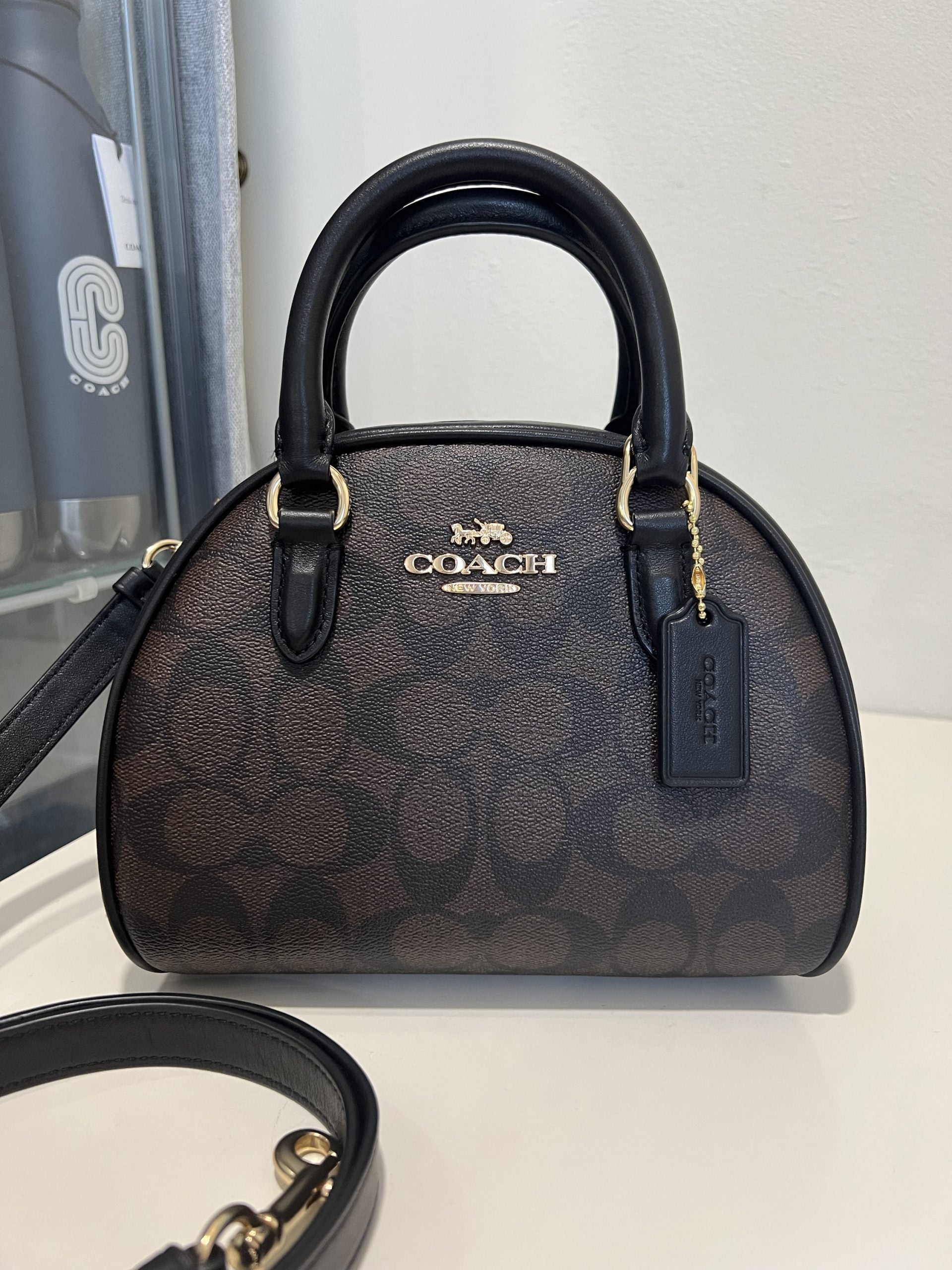 Sac à main Co@ch Sydney en marron et noir Signature