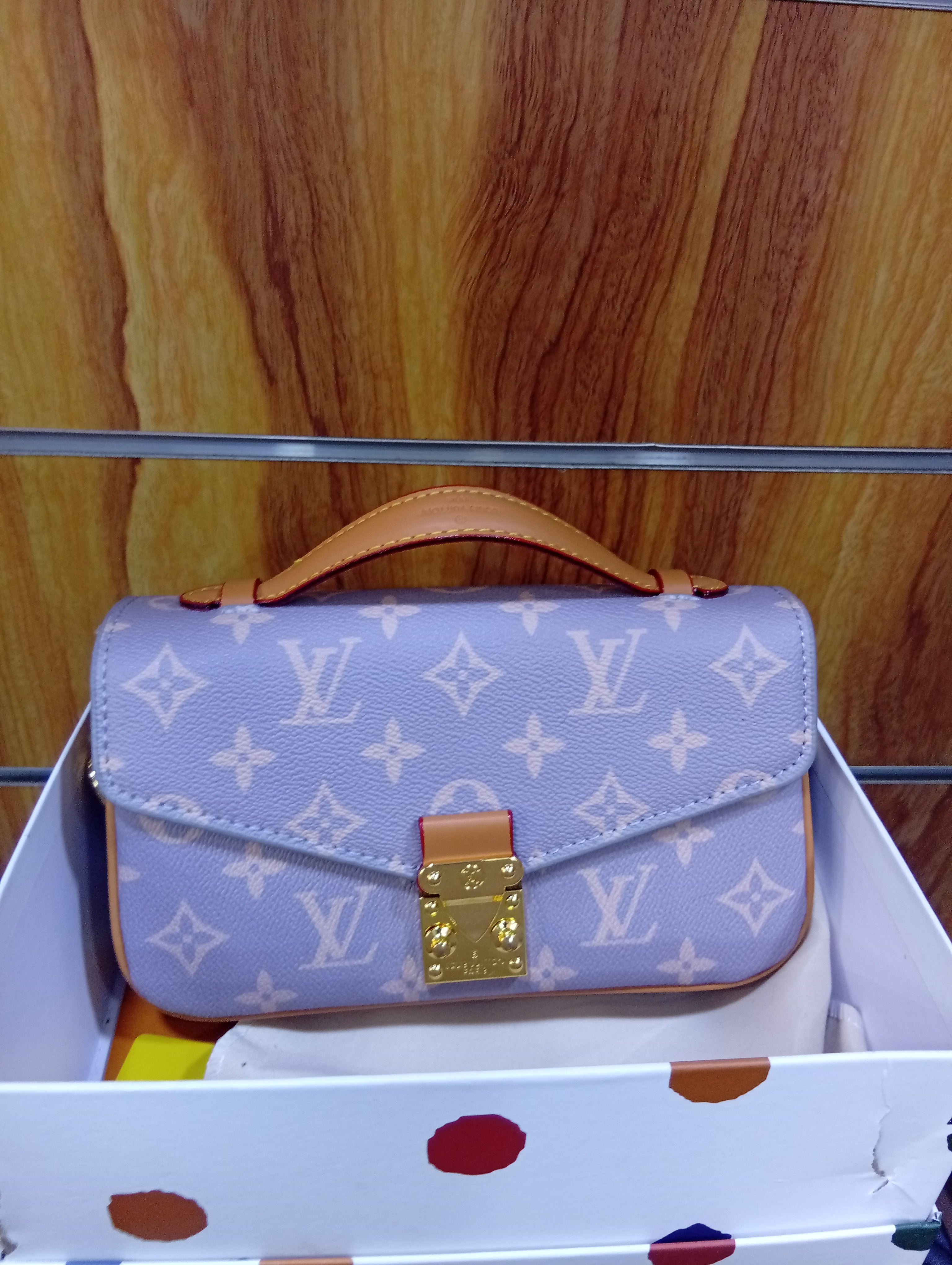 LV Pochette Métis East West M12429