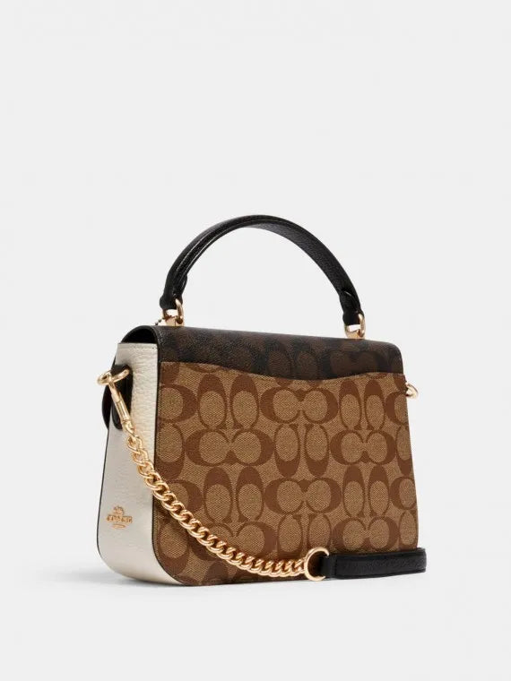 Sac à main Co@ch Marlie à poignée supérieure en toile à motif signature.